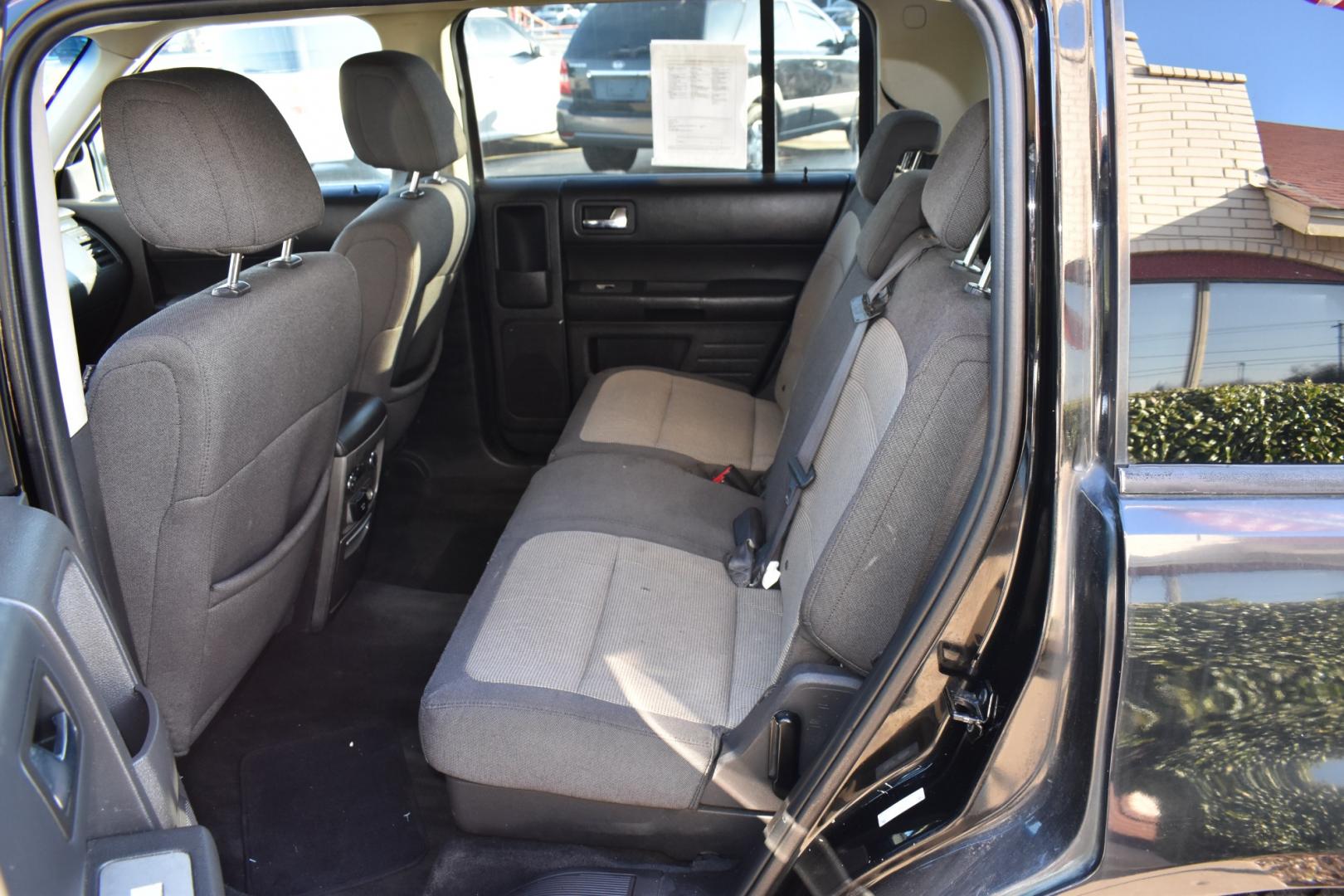 2009 Black /Gray Ford FLEX (2FMDK51C19B) with an V6, 3.5L engine, AUTOMATIC transmission, located at 5925 E. BELKNAP ST., HALTOM CITY, TX, 76117, (817) 834-4222, 32.803799, -97.259003 - Purchasing a 2009 Ford Flex can be a great decision for several reasons: Spacious and Versatile Interior: The Ford Flex is known for its spacious and comfortable interior, offering seating for up to seven passengers across three rows. The boxy design maximizes interior space, providing ample headro - Photo#24